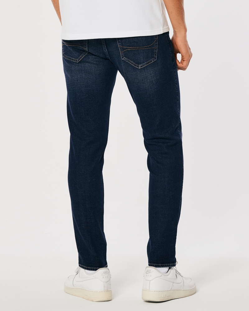 Jeans ajustados con lavado oscuro deportivos
