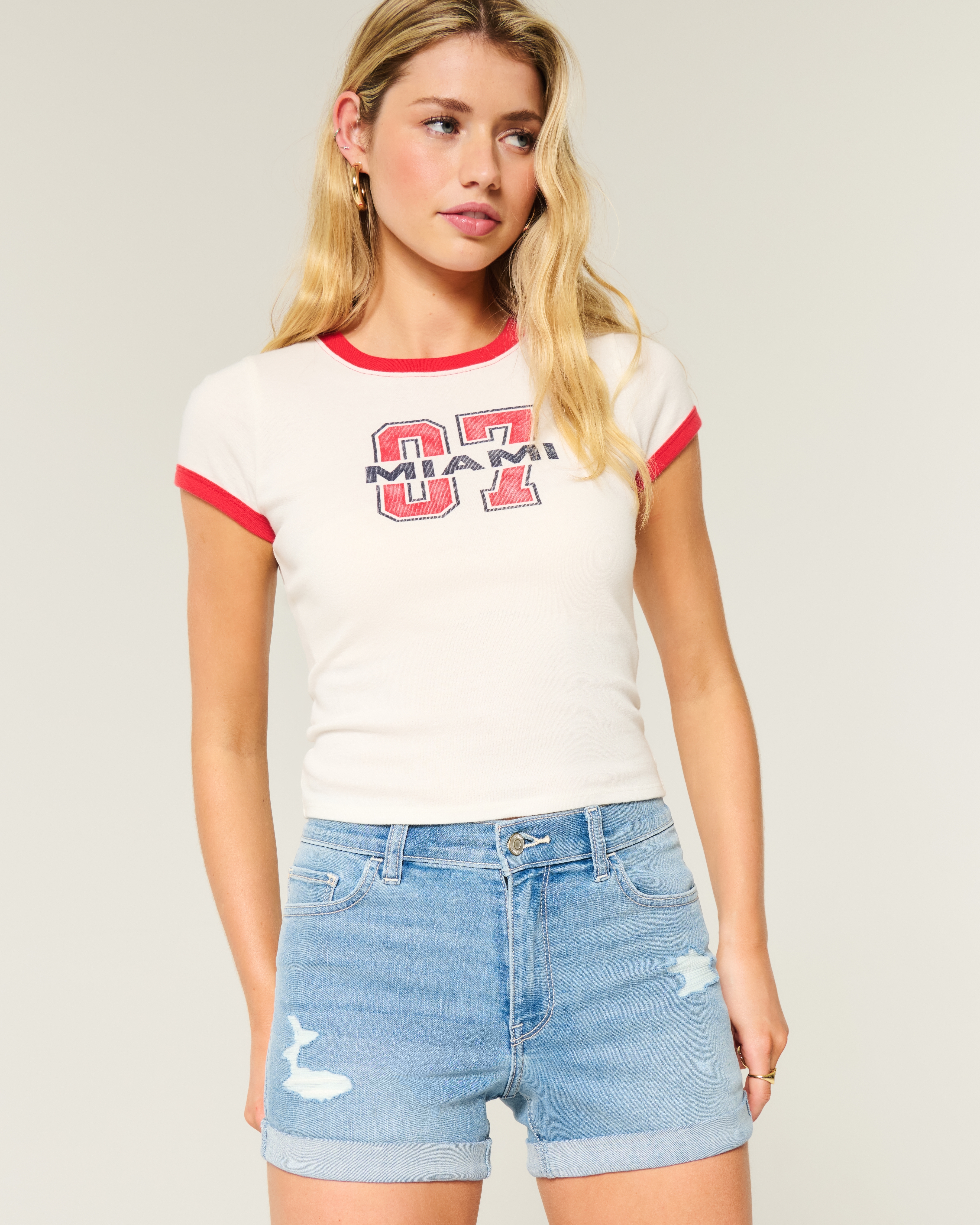 High-Rise Ripped Medium Light Wash Denim Shortie Shorts