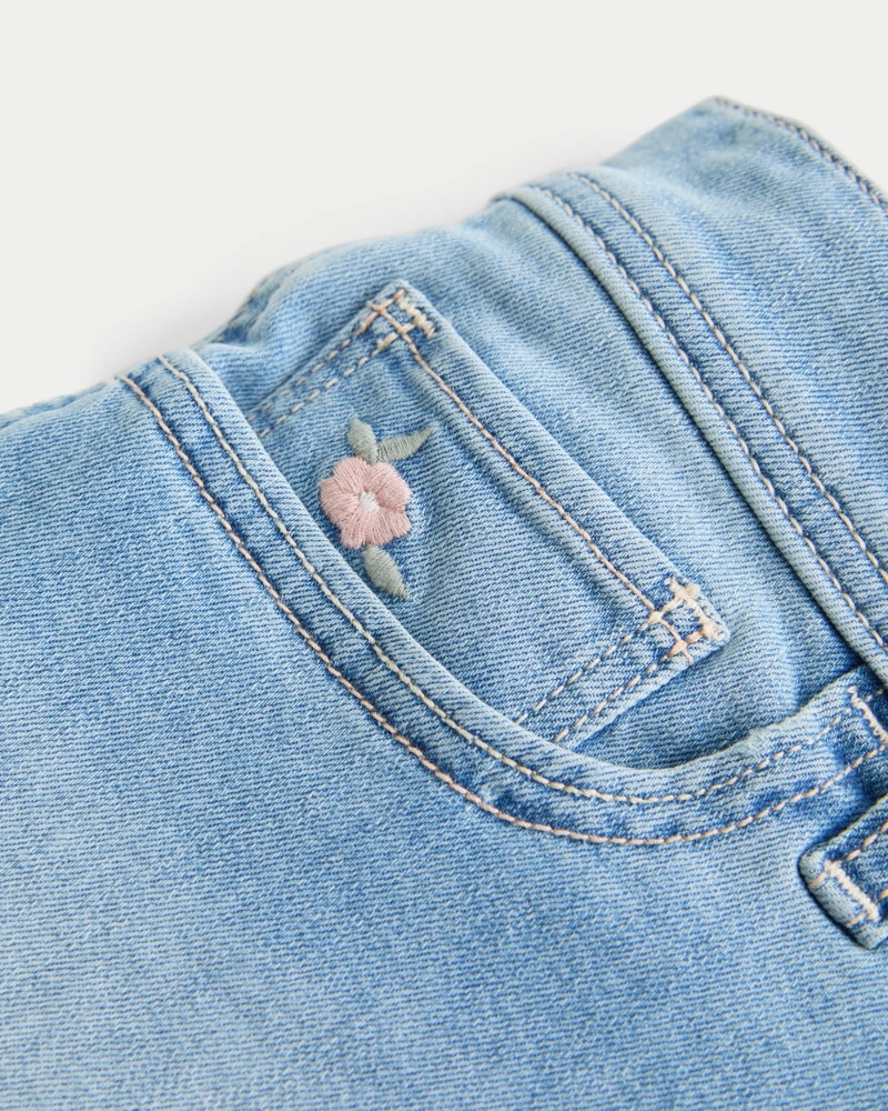 Low-Rise Light Wash Floral Embroidered Denim Shortie Shorts
