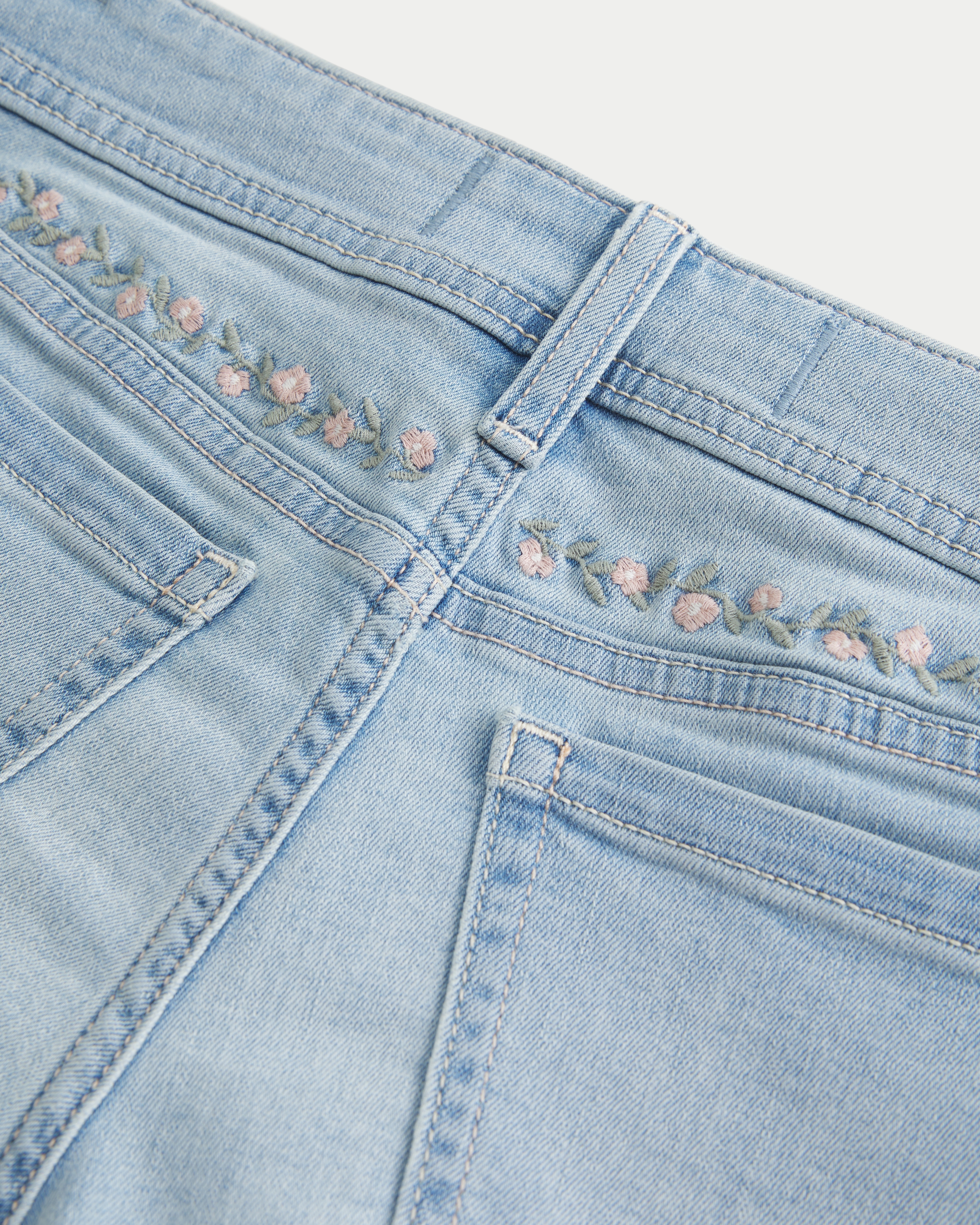 Curvy Low-Rise Light Wash Floral Embroidered Denim Shortie Shorts