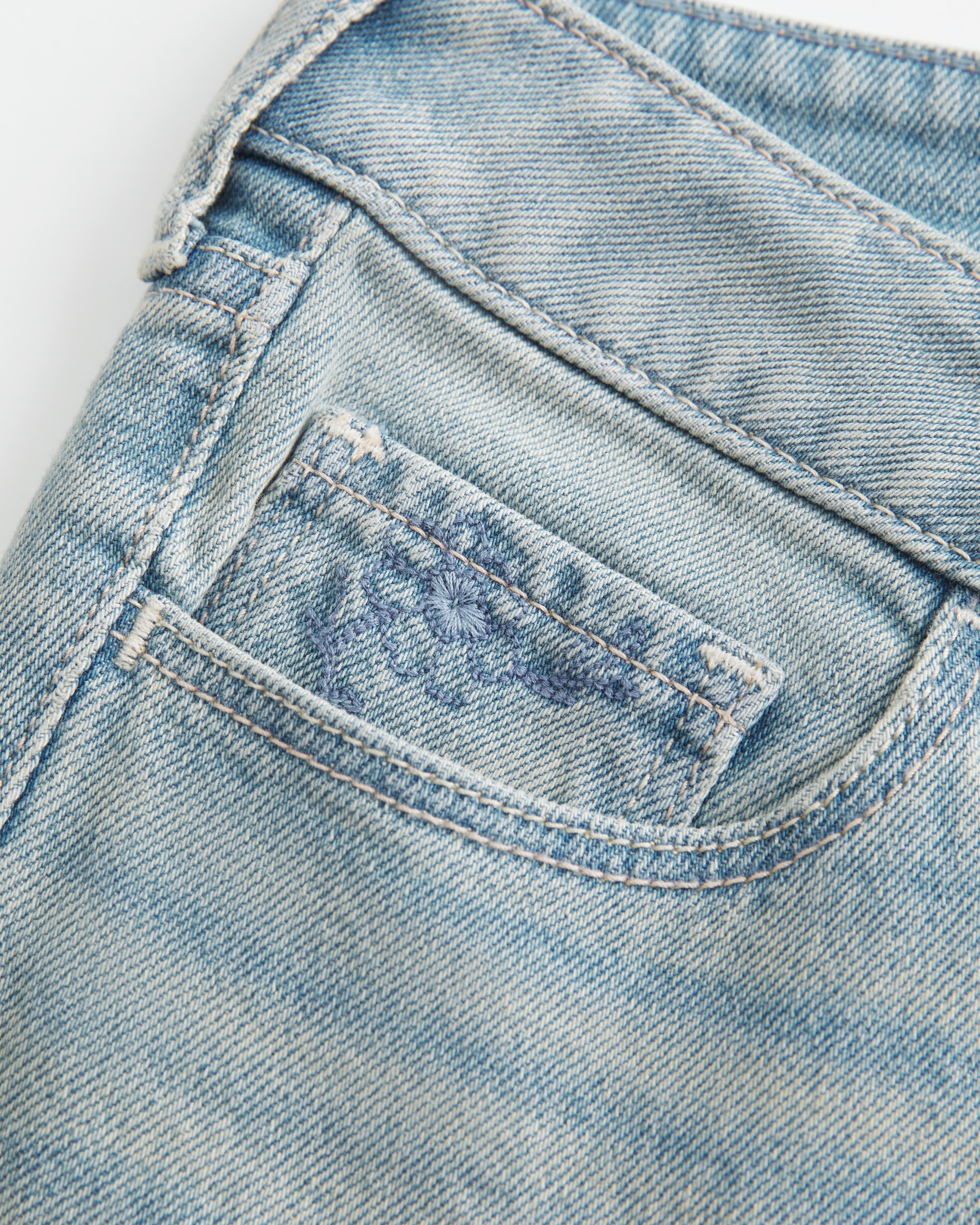Low-Rise Light Wash Floral Embroidery Boot Jeans