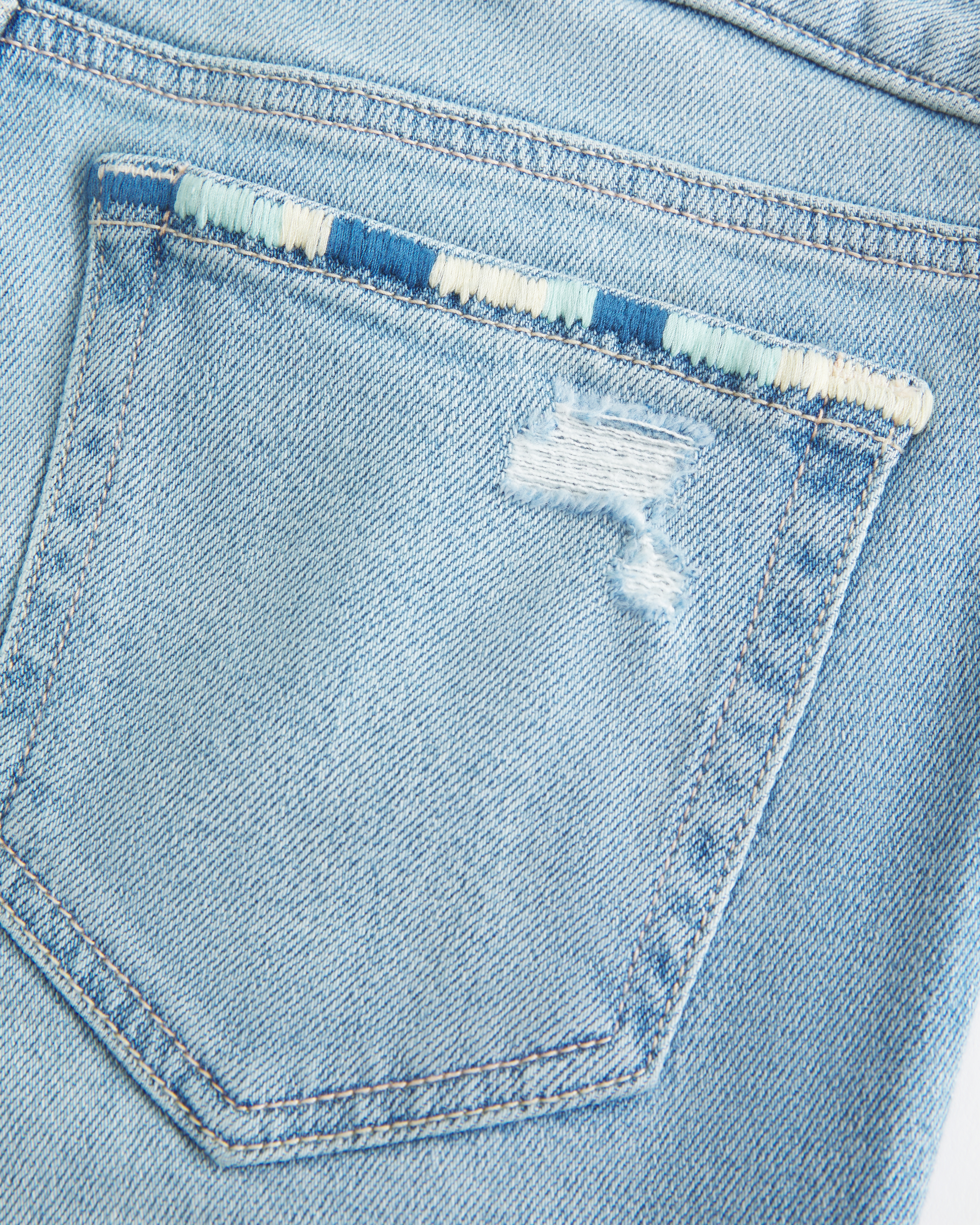 Low-Rise Ripped Light Wash Embroidered Boot Jeans