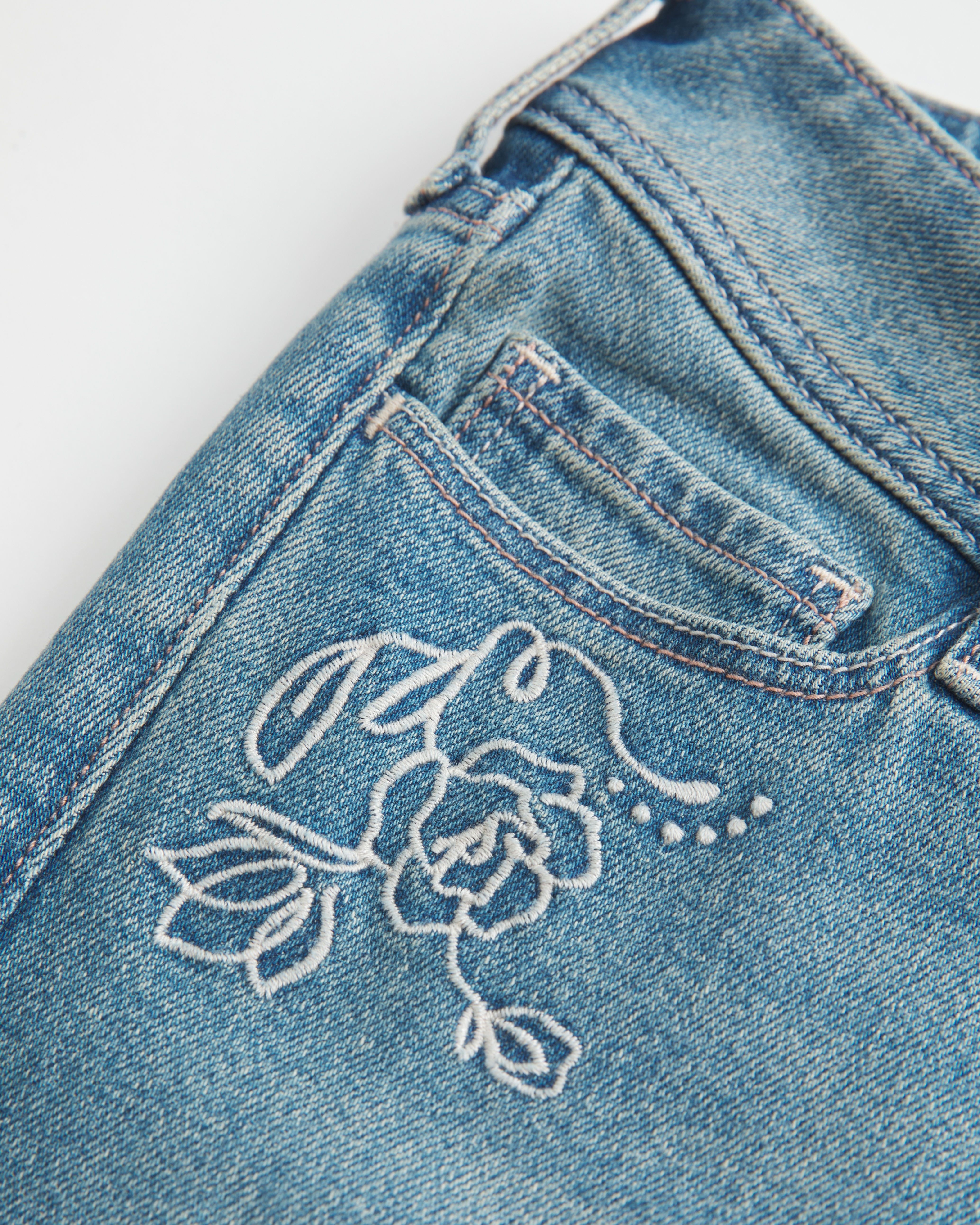 Ultra Low-Rise Medium Wash Floral Embroidery Flare Jeans