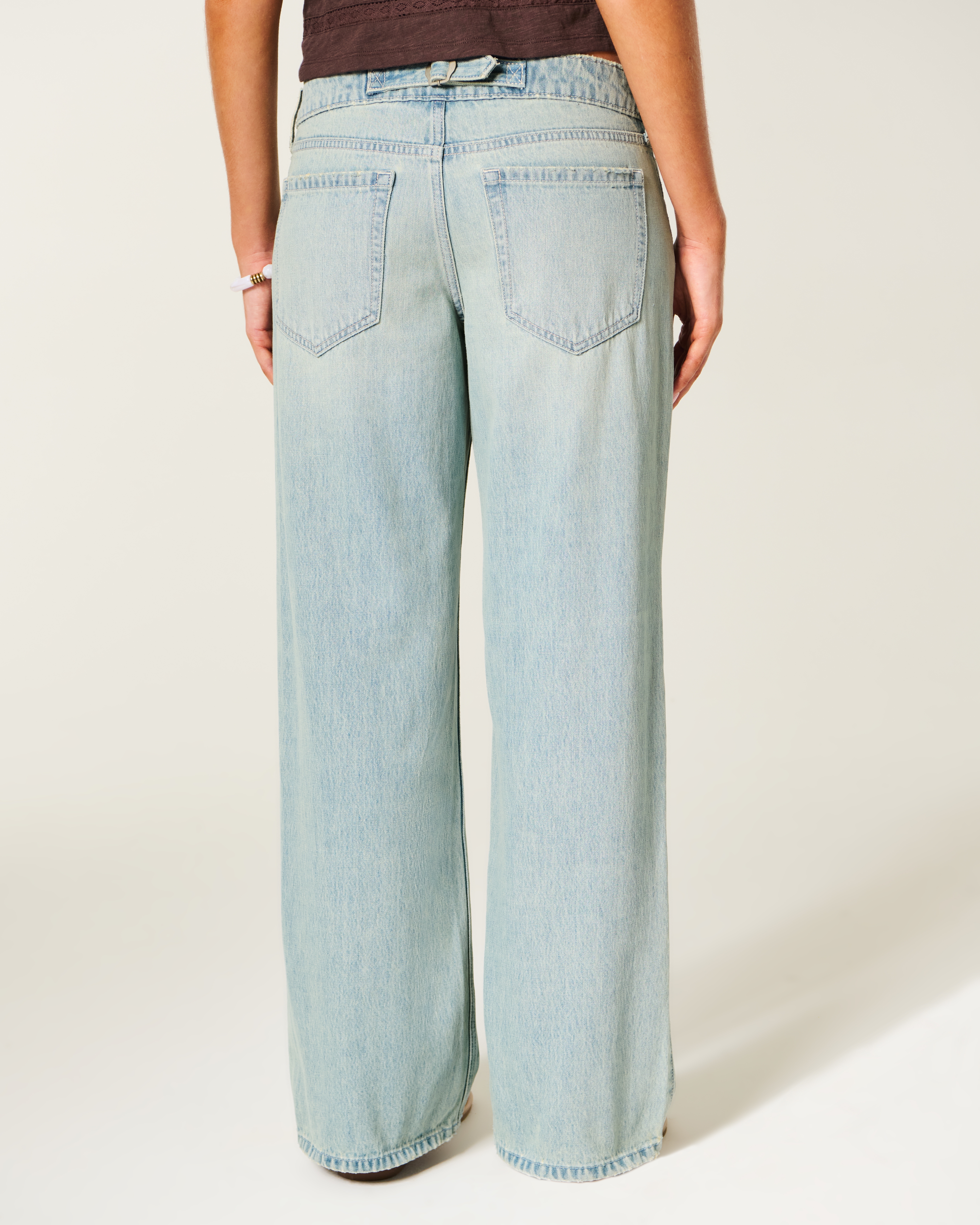 Ultra Low-Rise Light Wash Buckle Back Baggy Jeans