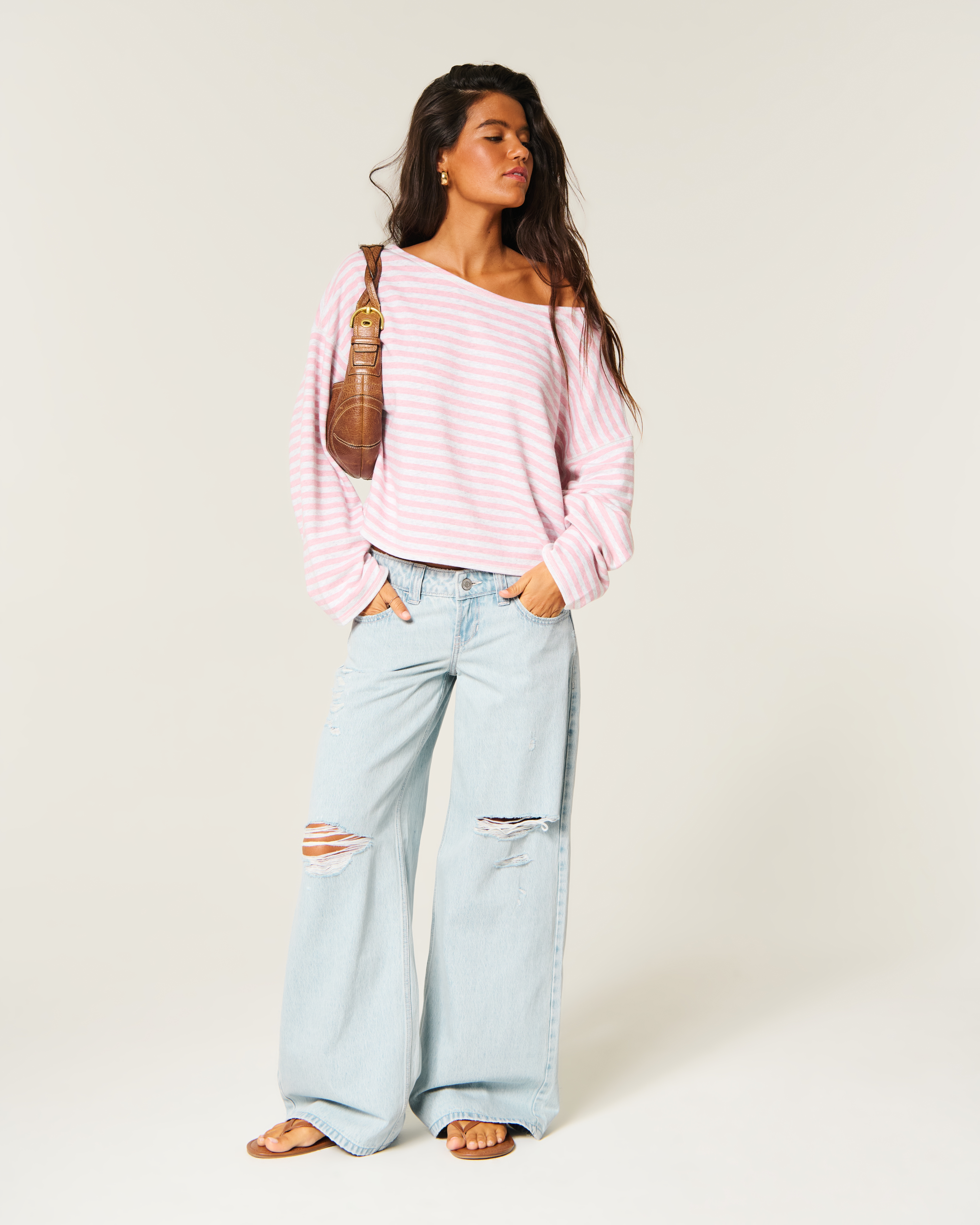 Ultra Low-Rise Ripped Light Wash Super Baggy Jeans